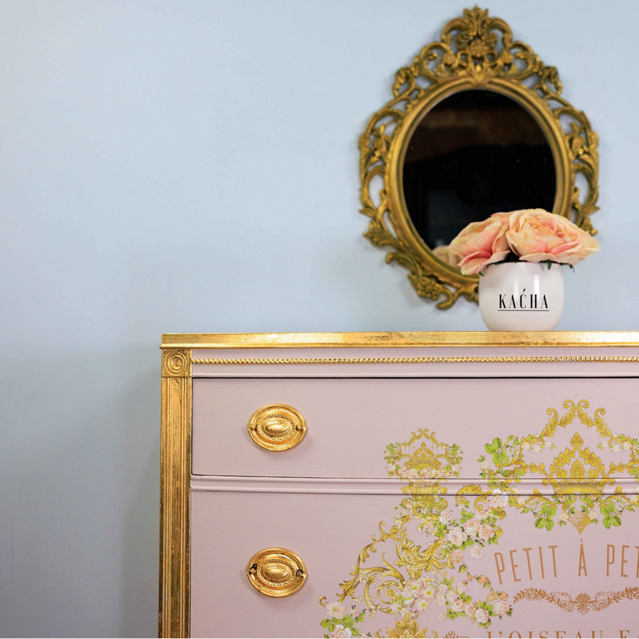 A vintage dresser refurbished by Kacha is painted a soft rose pink and features the Imitation Gold Leaf Foil on the trims and knobs.