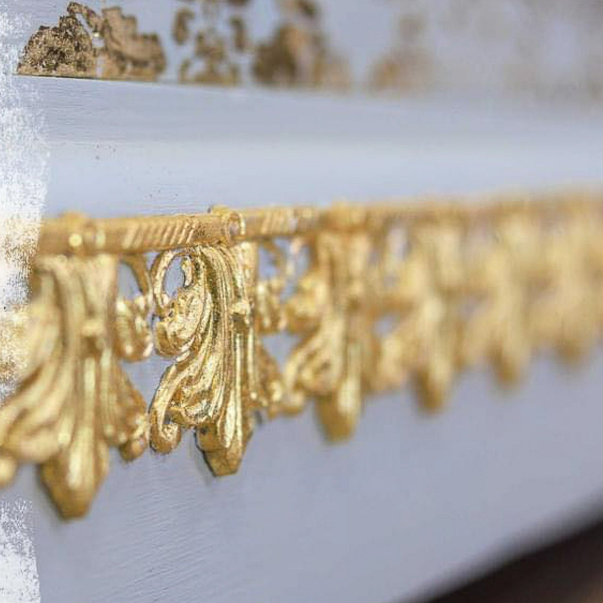 A close-up of ReDesign with Prima's Enlightened Etchings silicone mould in gold.