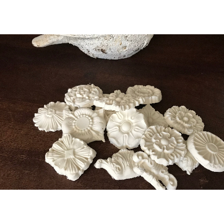White mold castings made with Redesigns air dry modeling material.