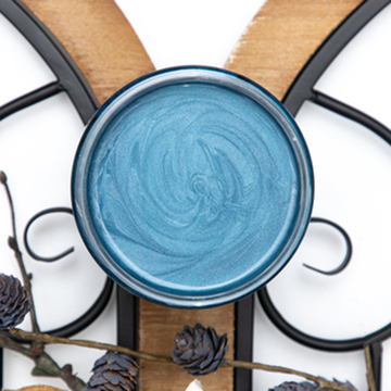 A open Pacific Dixie Belle Moonshine Metallic Chalk Paint container.