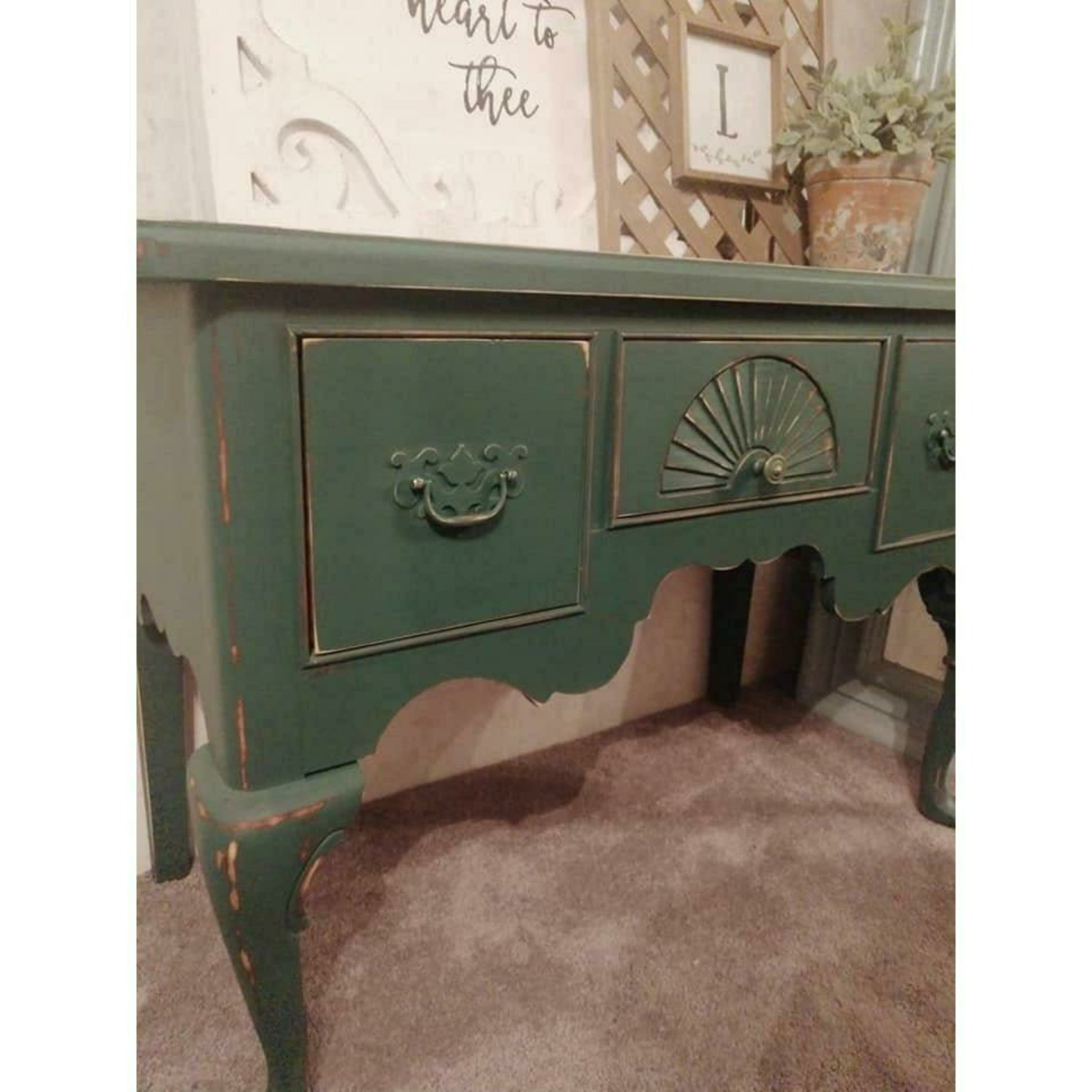 A vintage desk is painted in Dixie Belle's Palmetto chalk mineral paint.