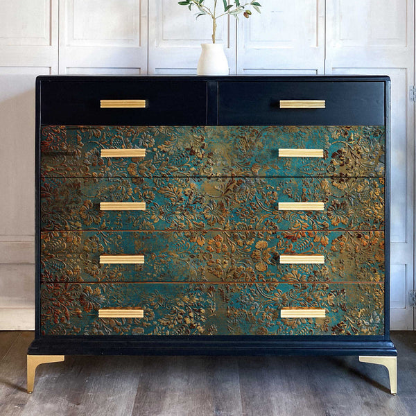 A vintage 6-drawer dresser is painted dark blue and features the Aged Patina A1 Fiber paper on it's bottom 4 drawers.