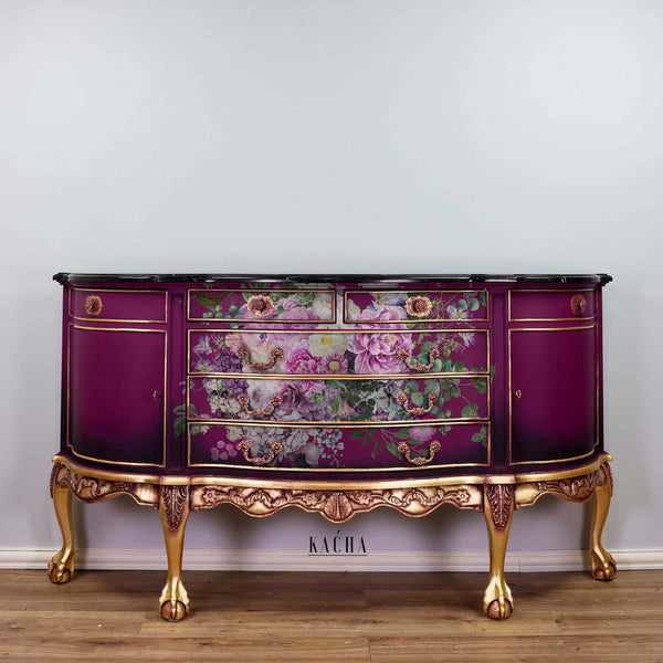 A vintage dresser refurbished by Kacha is painted deep purple with bronze accents and features the Kacha Morning Purple transfer on it.