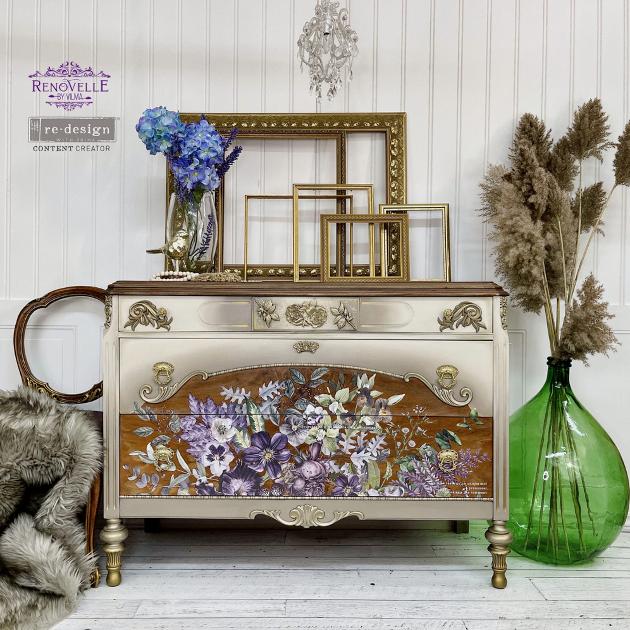 A vintage dresser refurbished by Renovelle by Vilma is painted champagne gold with natural wood and features ReDesign with Prima's Vigorous Violet transfer on its drawers.
