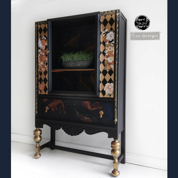A vintage cabinet refurbished by Flipped & Chipped Co. is painted black with gold accents and features the Classic Peach Flowers small transfer on it.