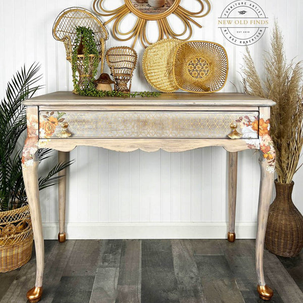A vintage desk refurbished by New Old Finds is stained a nautral wood color with bronze accents and features the Classic Peach Flowers small transfer on it.