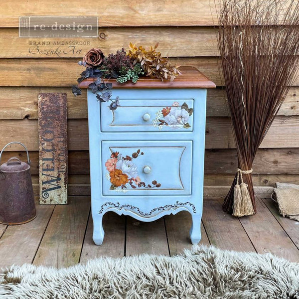 A small 2-drawer nightstand refurbished by Bozenka Art is painted a light blue and features the Classic Peach Flowers small transfer on its drawers.