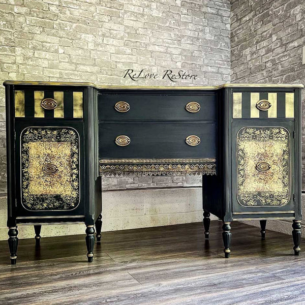 A vintage vanity desk refurbished by ReLove ReStore is painted black with gold accents and features the Delicate Lace small transfers on it.