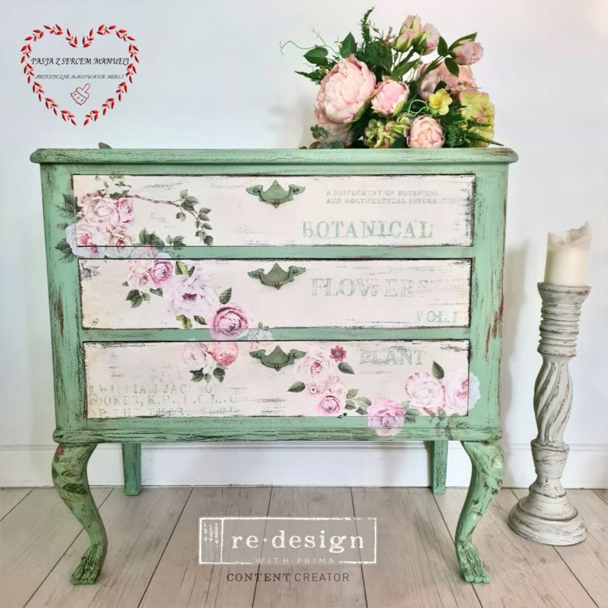 A vintage 3-drawer dresser is painted green with light beige drawers. The Delicate Roses small transfer is featured across the drawers.