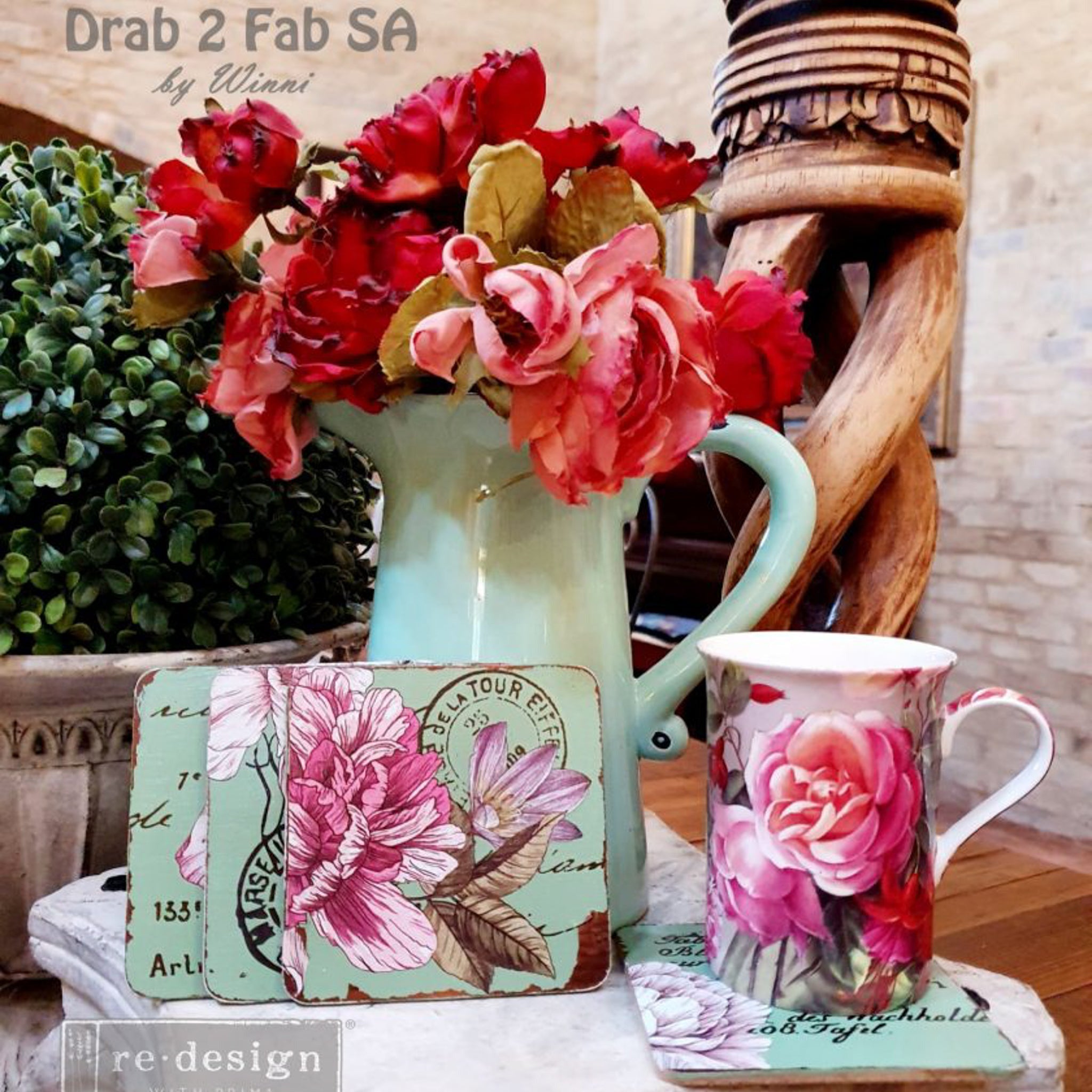 Wood coasters refurbished by Drab 2 Fab SA by Winni are painted mint green and feature the Dreamy Florals small transfer on them.