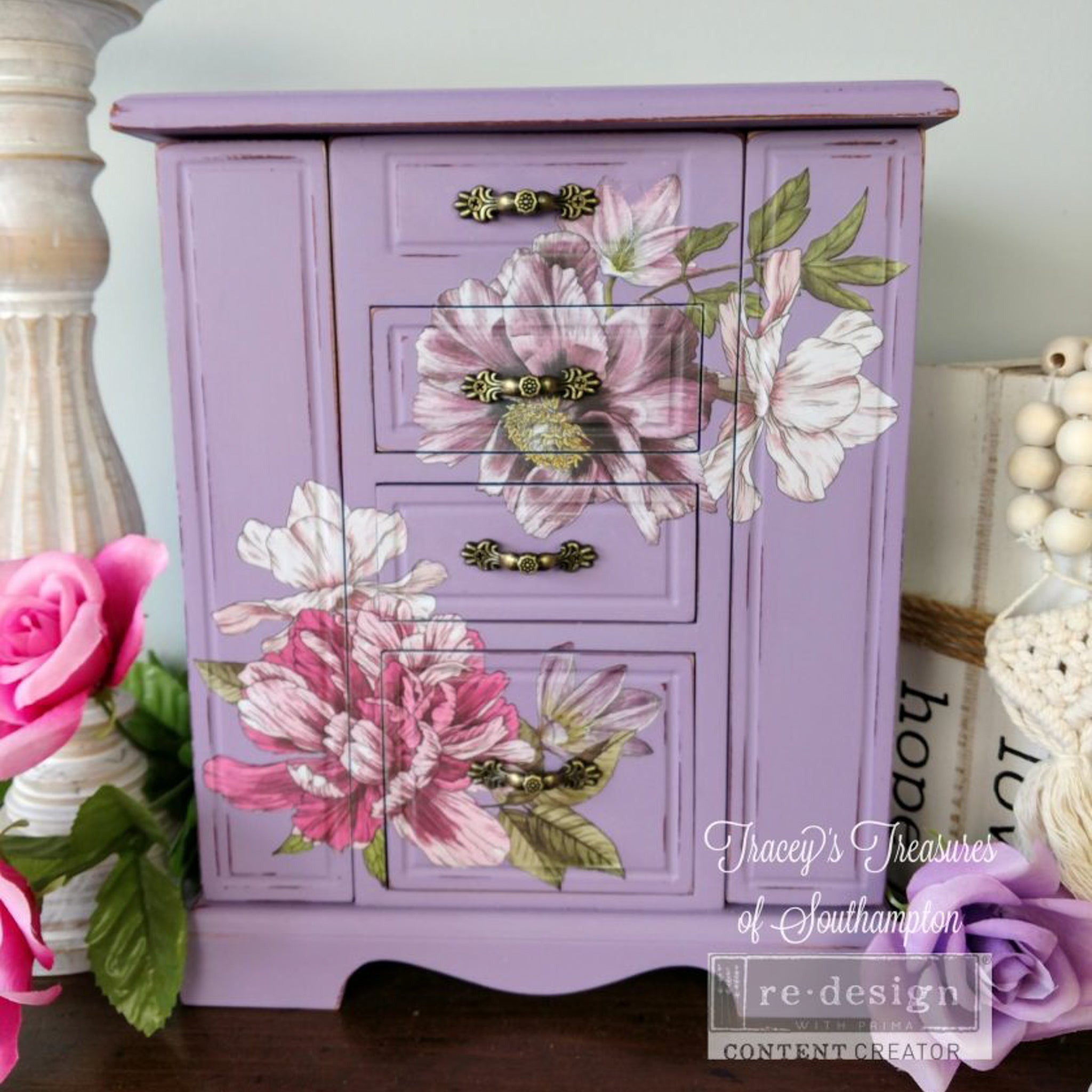 A vintage jewelry box refurbished by Tracey's Treasures of Southampton a ReDesign with Prima Content Creator, is painted lavender and features the Dreamy Florals small transfer on it.