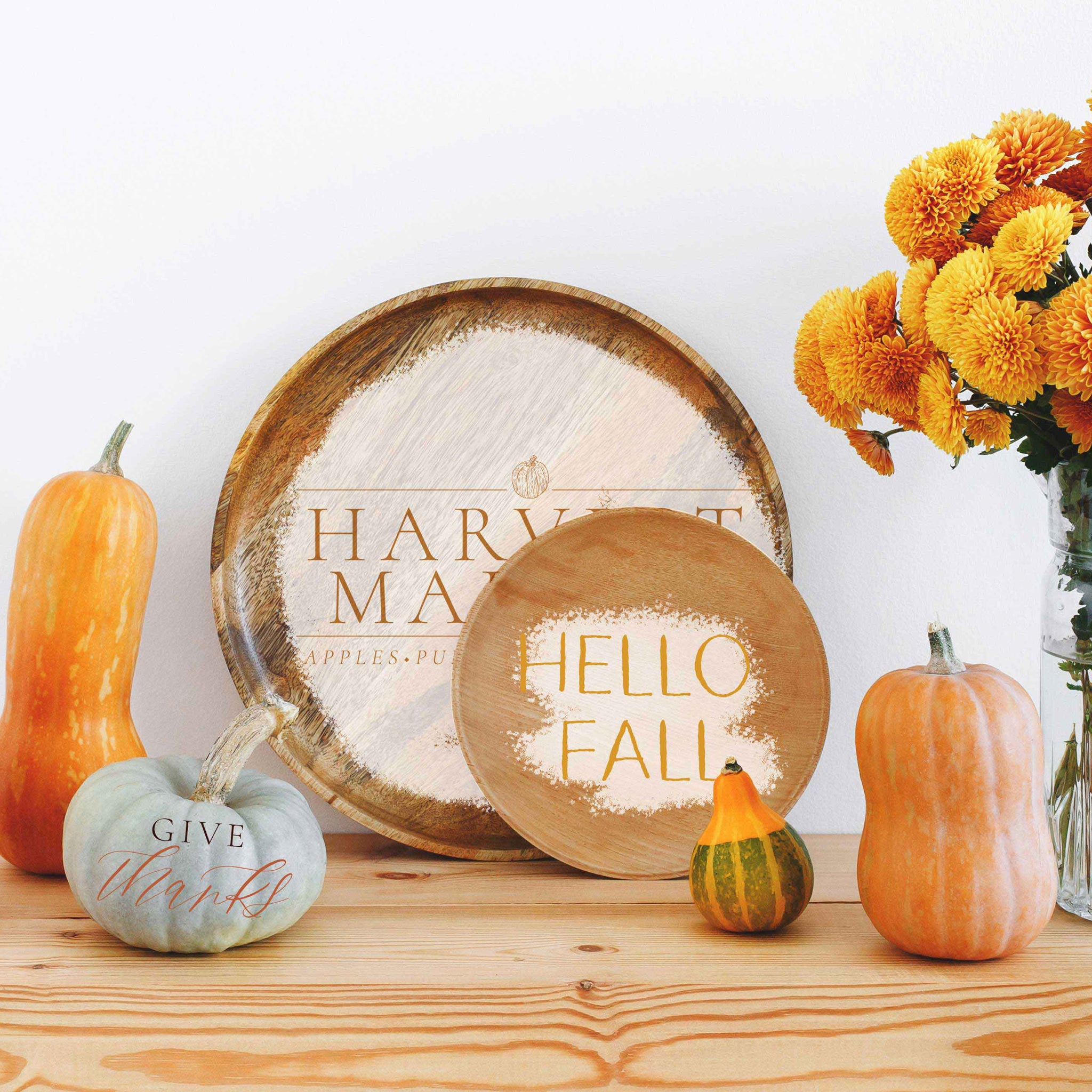 Wood plates, pumpkins, and gourds feature the Fall Festive small transfer on them.