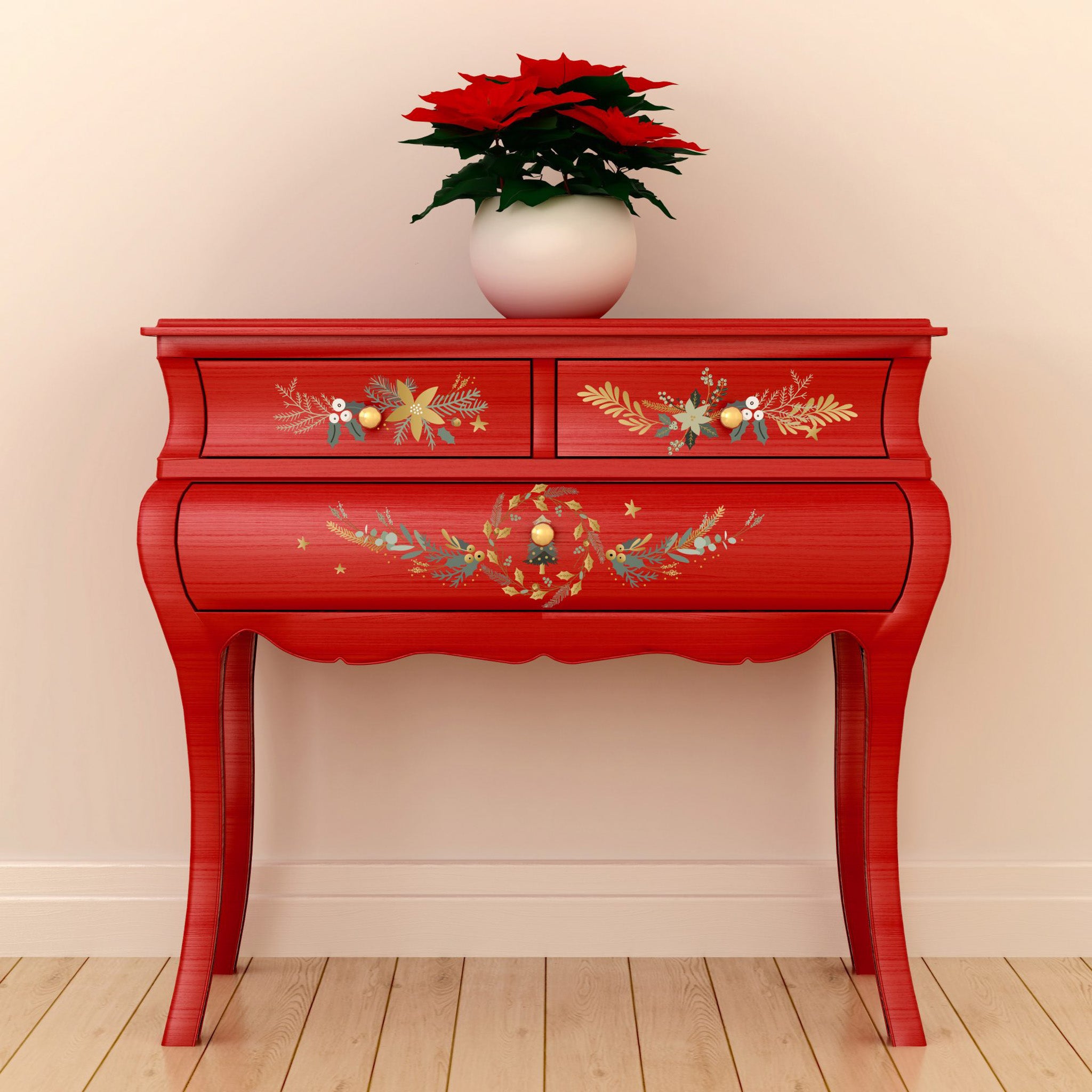 A vintage red side table features ReDesign with Prima's Holiday Spirit small transfer on its 3 small drawers.