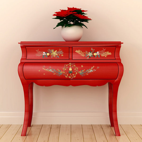 A vintage red side table features the Holiday Spirit small transfer on its 3 small drawers.