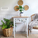 A small end table refurbished by Lubbly Jubbly Furniture is painted white with a natural wood top nd featurers ReDesign with Prima's White Magnolia small transfer on its drawer.