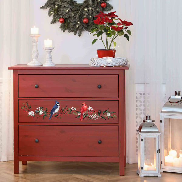 A 3-drawer dresser is painted rust red and features ReDesign with Prima's Winterberry small transfer on its center drawer.