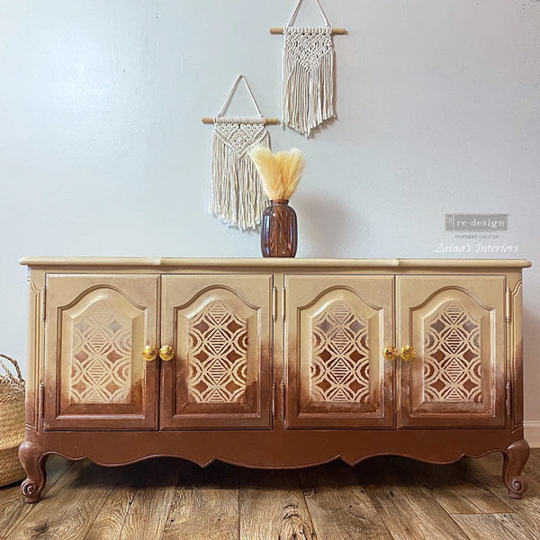 Vintage buffet table refurbished by Zaina's Interiors, a ReDesign Content Creator, is painted a blend of light and dark brown and features the Boho Vibes stencil on it.