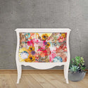 Vintage dresser painted white and features the Abstract Beauty Tissue paper on its drawers.