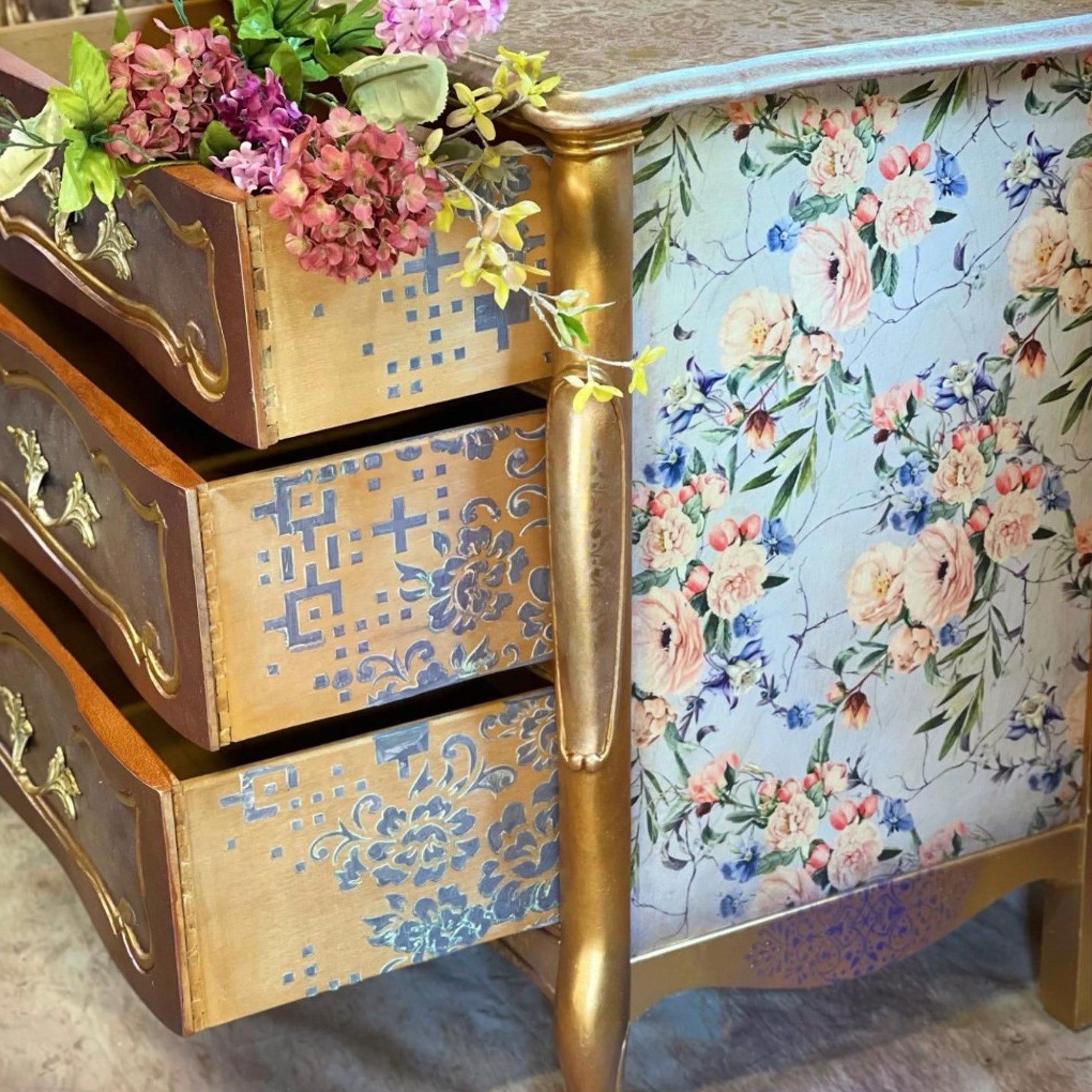 A vintage 3-drawer nightstand is painted gold and features the Lavender Fleur tissue paper on the sides.
