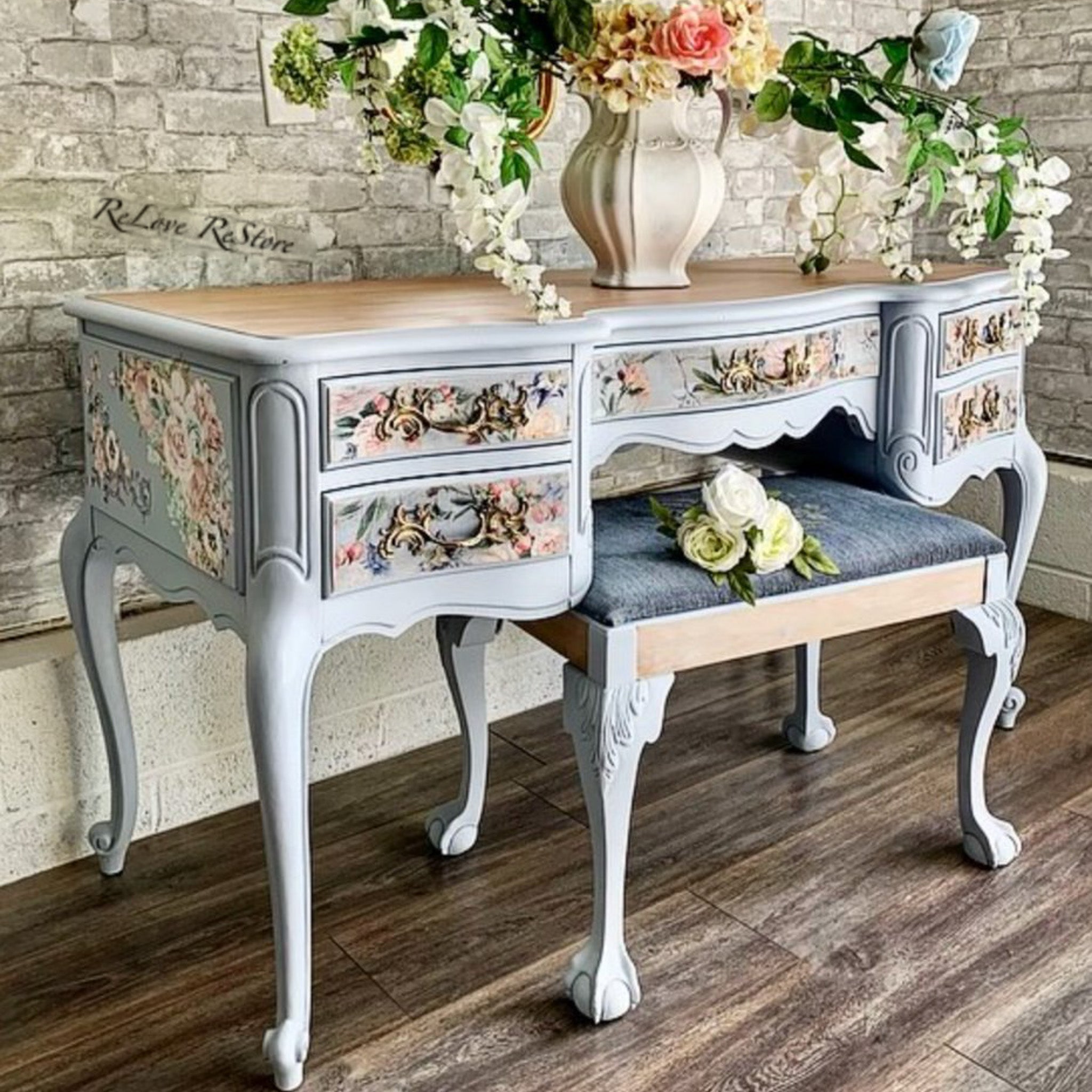 A vintage vanity desk refurbished by ReLove ReStore is painted pale blue and features the Lavender Fleur tissue paper on it.
