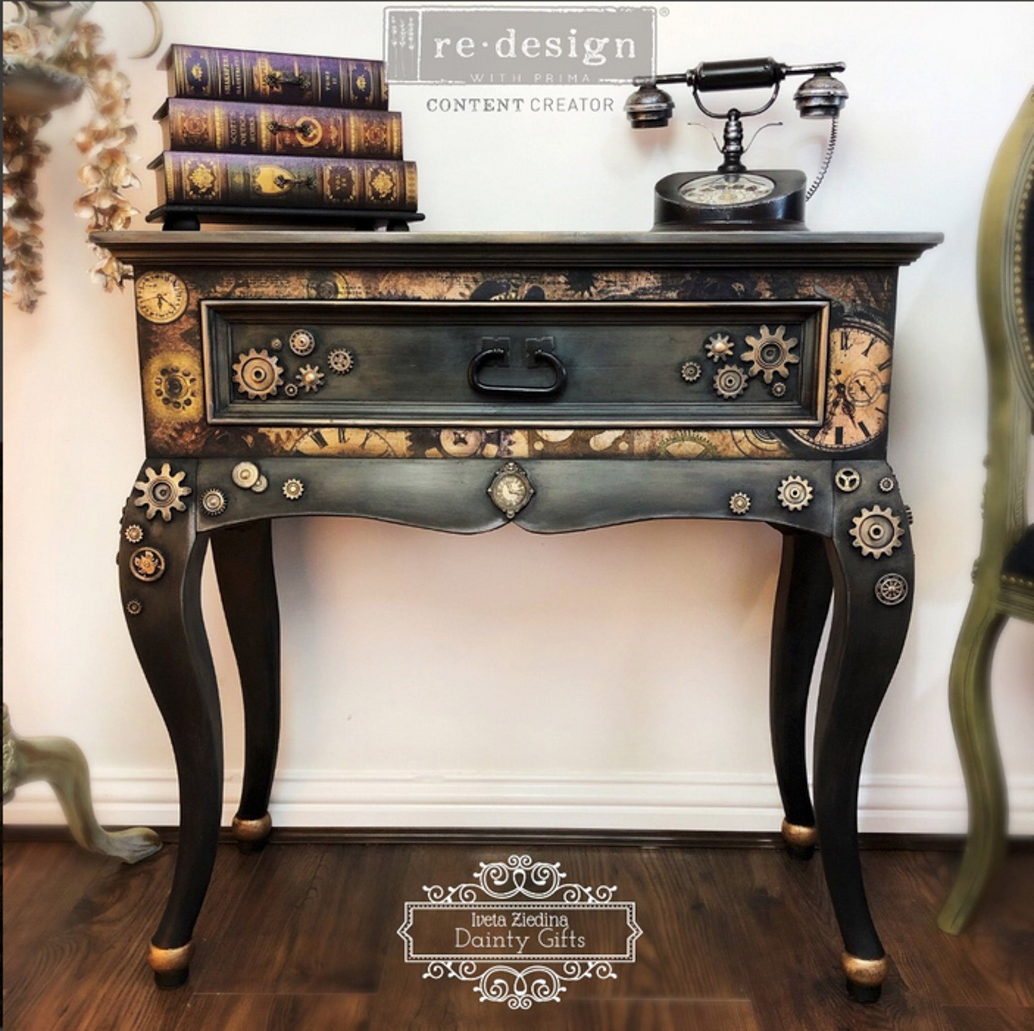 A vintage end table with 1 drawer refurbished by Iveta Ziedina Dainty Gifts is painted black and dark brown and features ReDesign with Prima's Timeworks tissue paper on it.