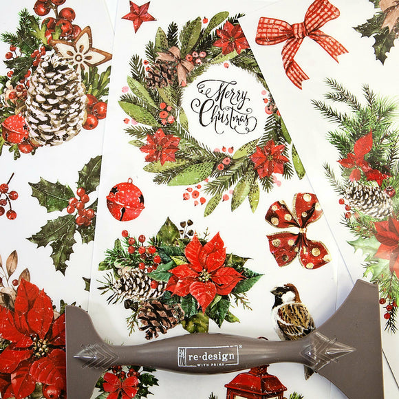 Three Classic Christmas small transfer sheets with a Redesign with Prima transfer tool sat on top.