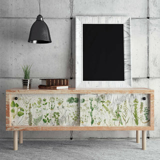 A wooden coffee table with the greenery transfer placed on the sides.