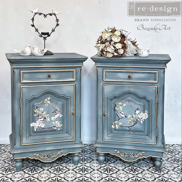 Two blue gray dressers with the Blossom Flight transfer on top. A Redesign brand ambassador Bozenka Art logo on the top right.