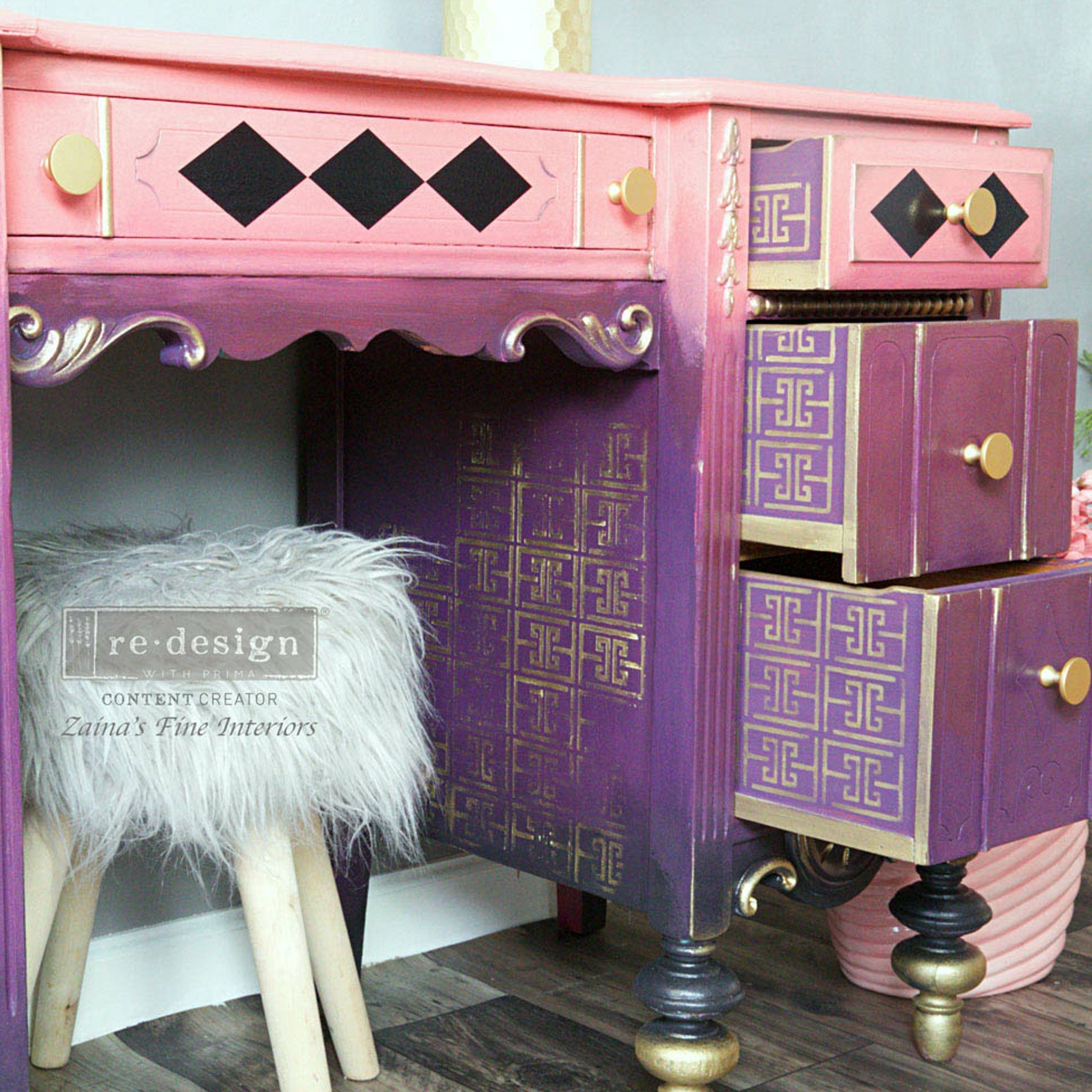 Purple and pink dresser with drawers pulled out and the Harlequin transfer on top. A Redesign content creator and Zainas Fine Interiors logo on the bottom right.