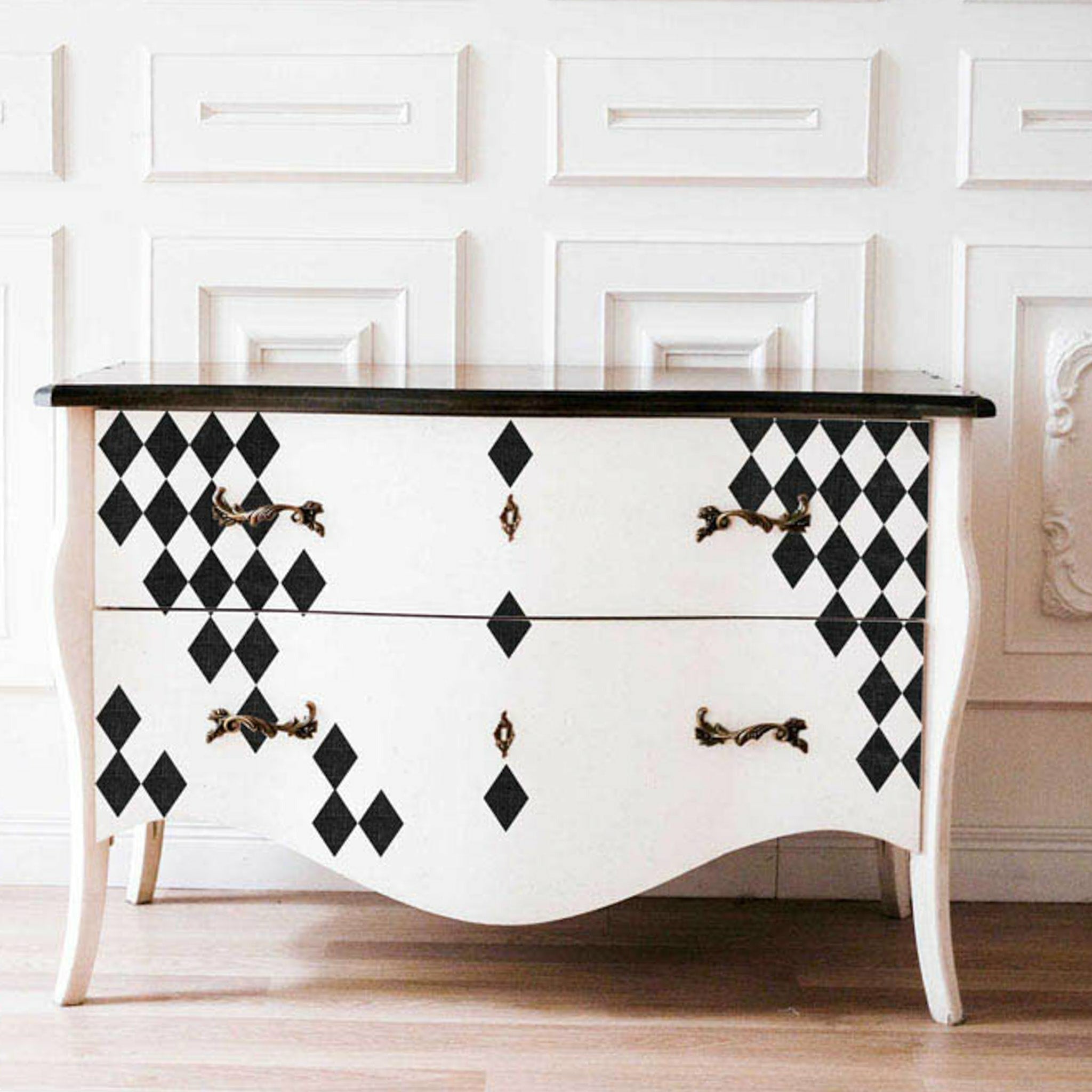 White dresser with the Harlequin transfer on top.