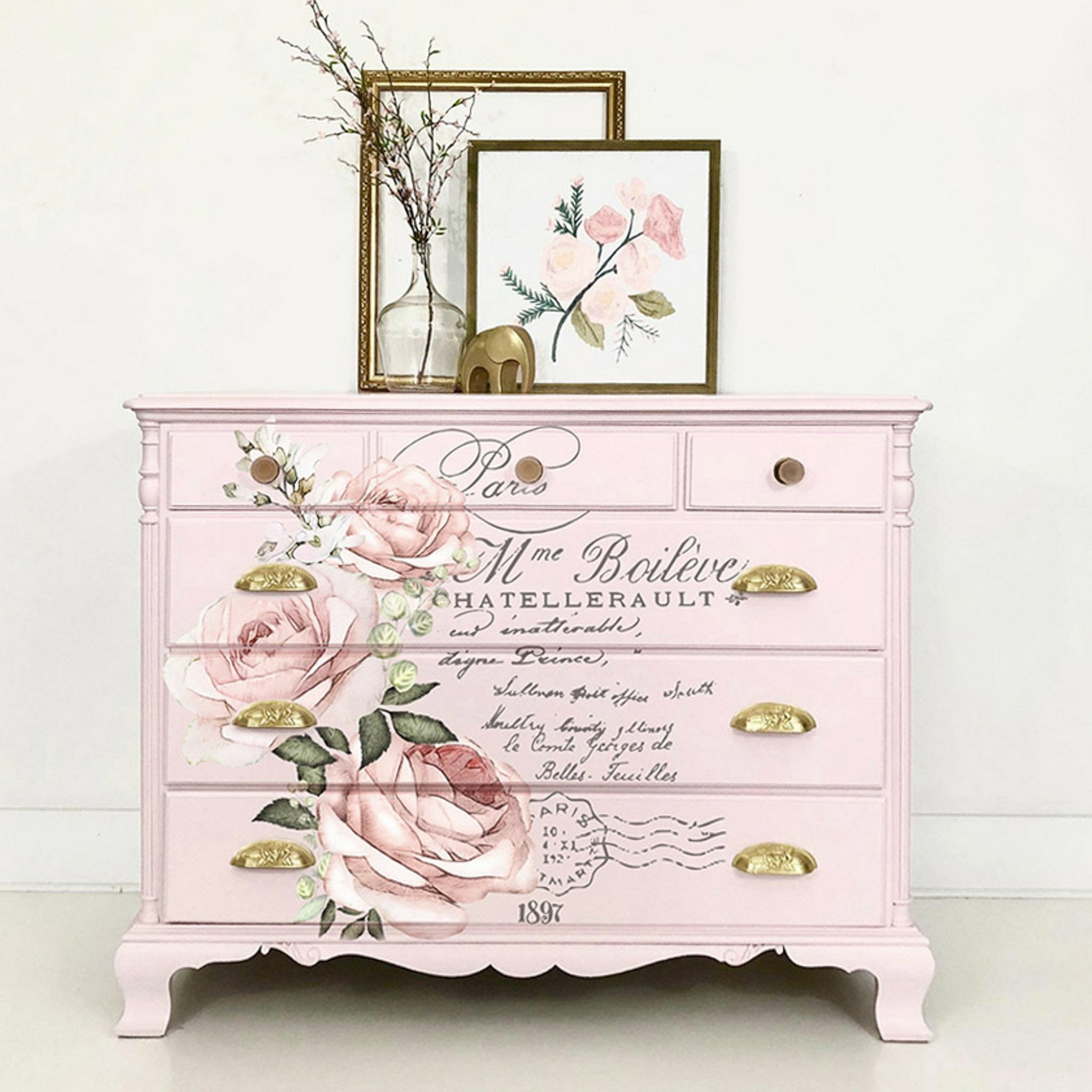 A vintage 6-drawer dresser is painted pale pink and features ReDesign with Prima's Chatellerault rub-on transfer on the drawers.