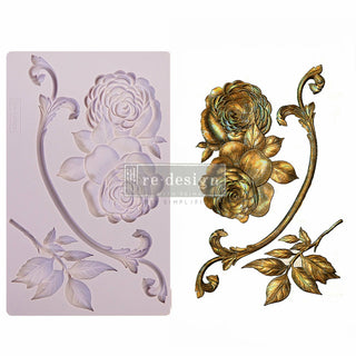 White background with the Victorian rose mold tray on the left. An example of the mold in gold is on the right. A transparent redesign logo is sat in the cnter.