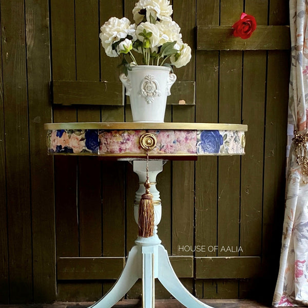 A small white table with the Fuchsia Meadow transfer on top. A white House of Aalia logo on the bottom right.