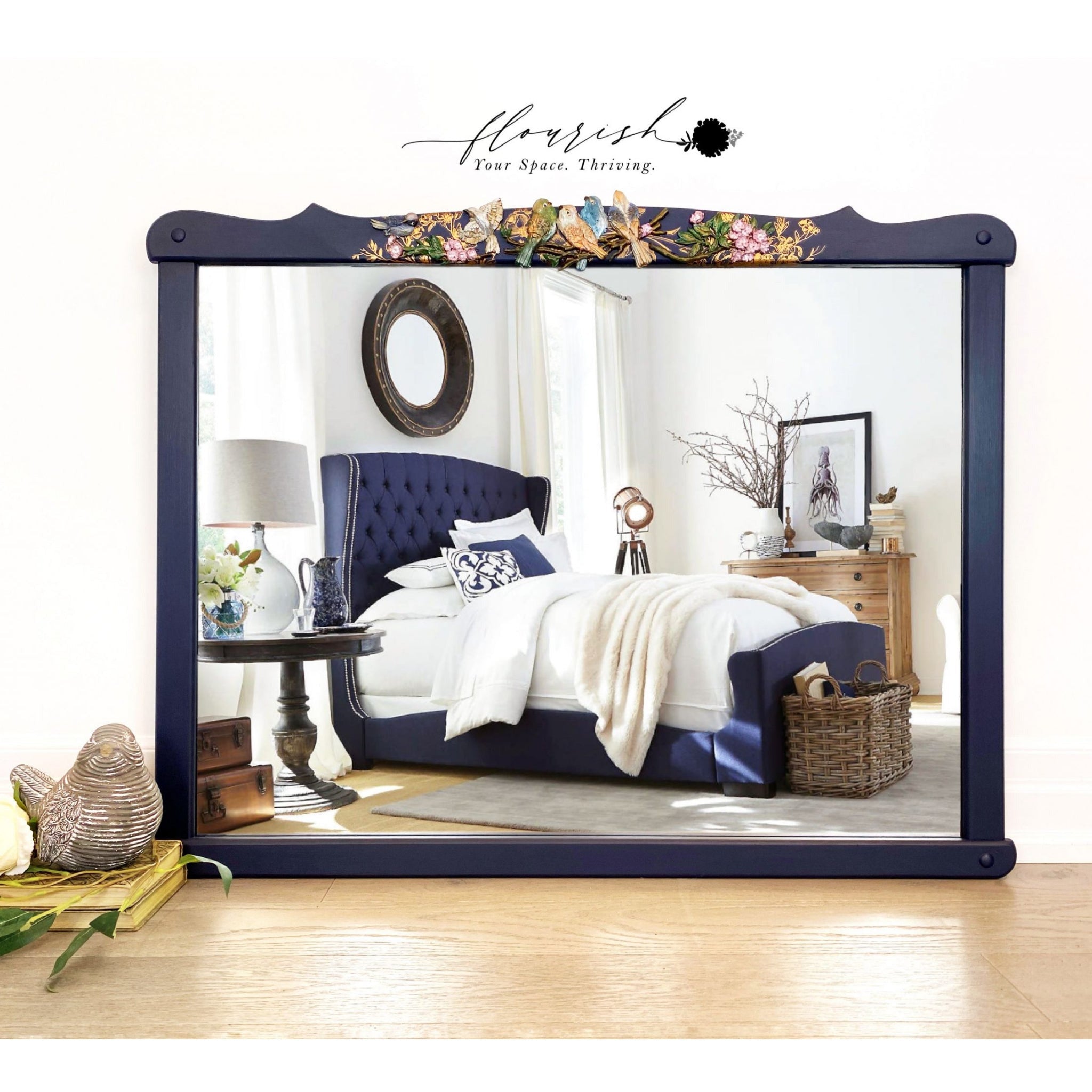 A blue framed mirror refurbished by Flourish You Space Thriving features the Avian Love silicone mould at the top.