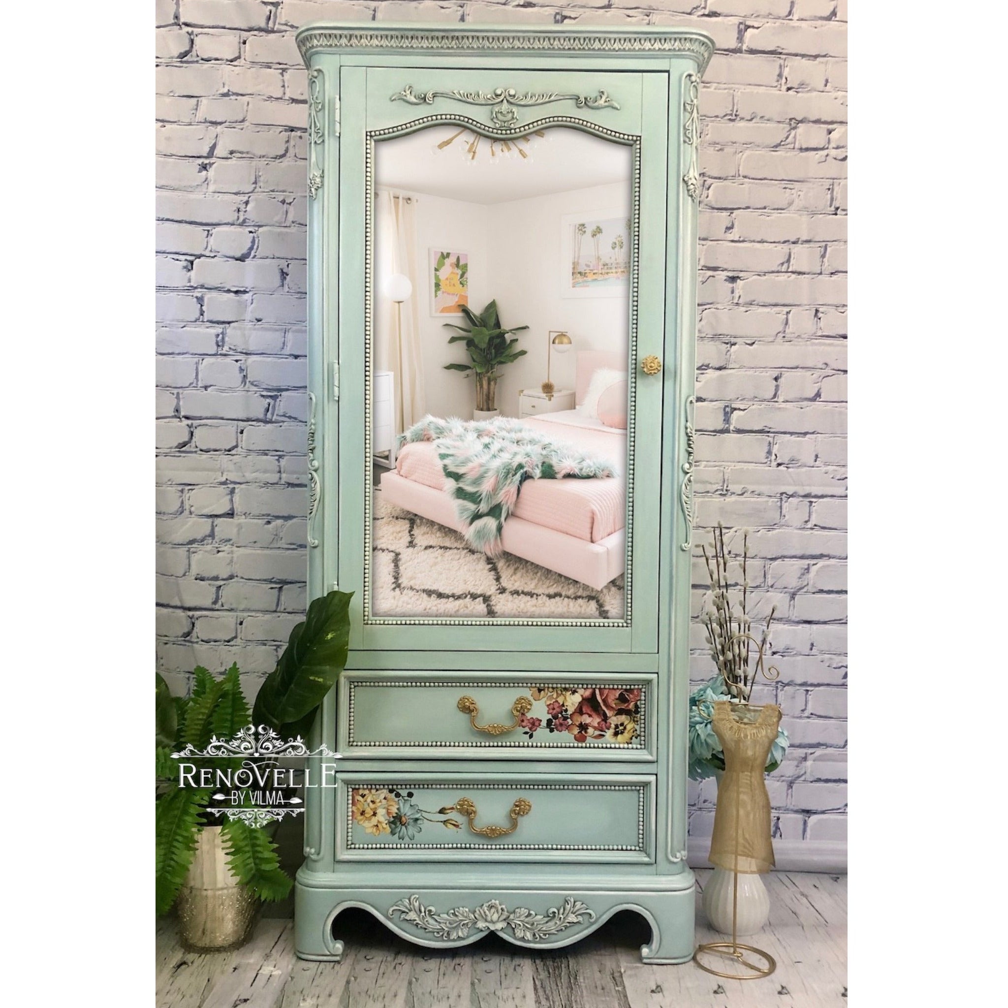 A vintage armoire refurbished by Renovelle by Vilma is painted mint green and features ReDesign with Prima's Baroque Swirls silicone mold castings on it.