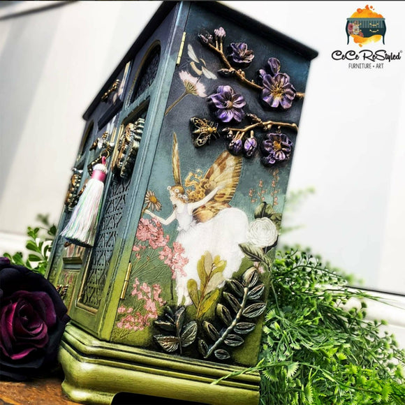 A vintage jewelry box refurbished by CeCe ReStyled is painted a blend of green and blue and features the Cherry Blossos silicone mould on it.