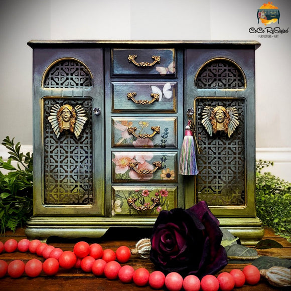 A vintage jewelry box refurbished by CeCe ReStyled is painted a blend of green and blue and features the Cherry Blossos silicone mould on it.