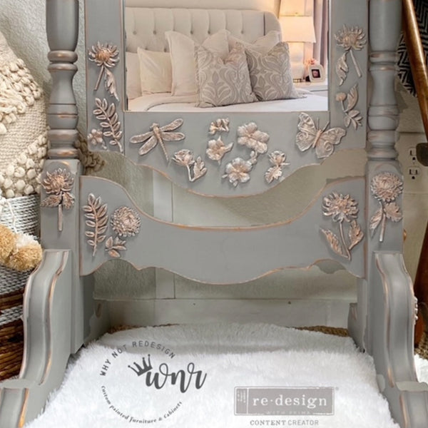 A close-up of a vintage standing mirror refurbished by Why Not Redesign, a ReDesign with Prima Content Creator, is painted light grey and features the Cherry Blossoms silicone mould castings on it.