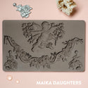 A brown silicone mould of ReDesign with Prima's Divine Floral silicone mould is on a light pink background.