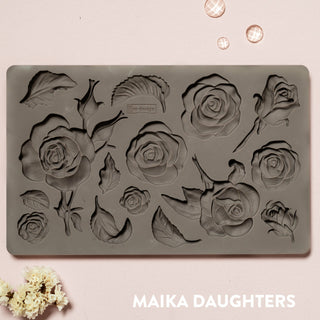 Brown silicone mould of ReDesign with Prima's Fragrant Roses is against a light pink background.
