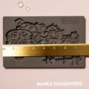 Golden Emblem mold tray with a ruler measuring 8 inches in width. A white Maika Daughters logo on the bottom right.