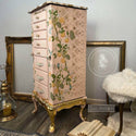 Tall pale pink and gold dresser with the Boho Vibes stencil on top. A white Rustic charm restored furniture art and Redesign content creator logo on the right.
