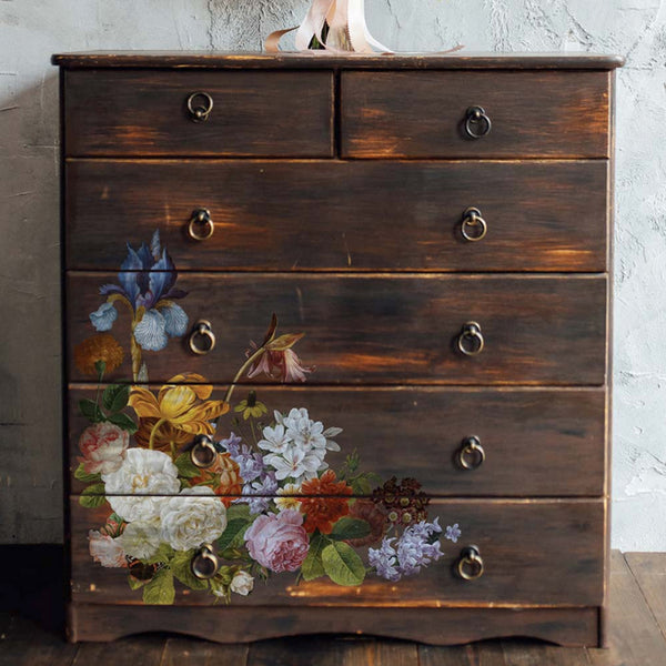A vintage 6-drawer dresser is painted in 2 tones of brown and features the Blossomed Beauties small on its drawers towards the bottom left corner.