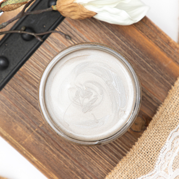 A open Steel Magnolia Dixie Belle Moonshine Metallic Chalk Paint container.