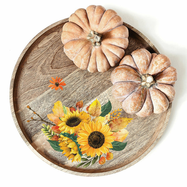 A wooden lazy susan that has the Sunflower Afternoon transfer on it. Displayed on top are 2 small pumpkins.