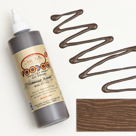 Dixie Belle's Tobacco Road Voodoo Gel Stain is against a white background with a wood stained swatch and a poured color sample.