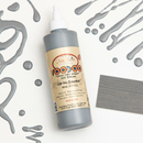 Dixie Belle's Up In Smoke Voodoo Gel Stain is against a white background with a wood stained swatch and a poured color sample.