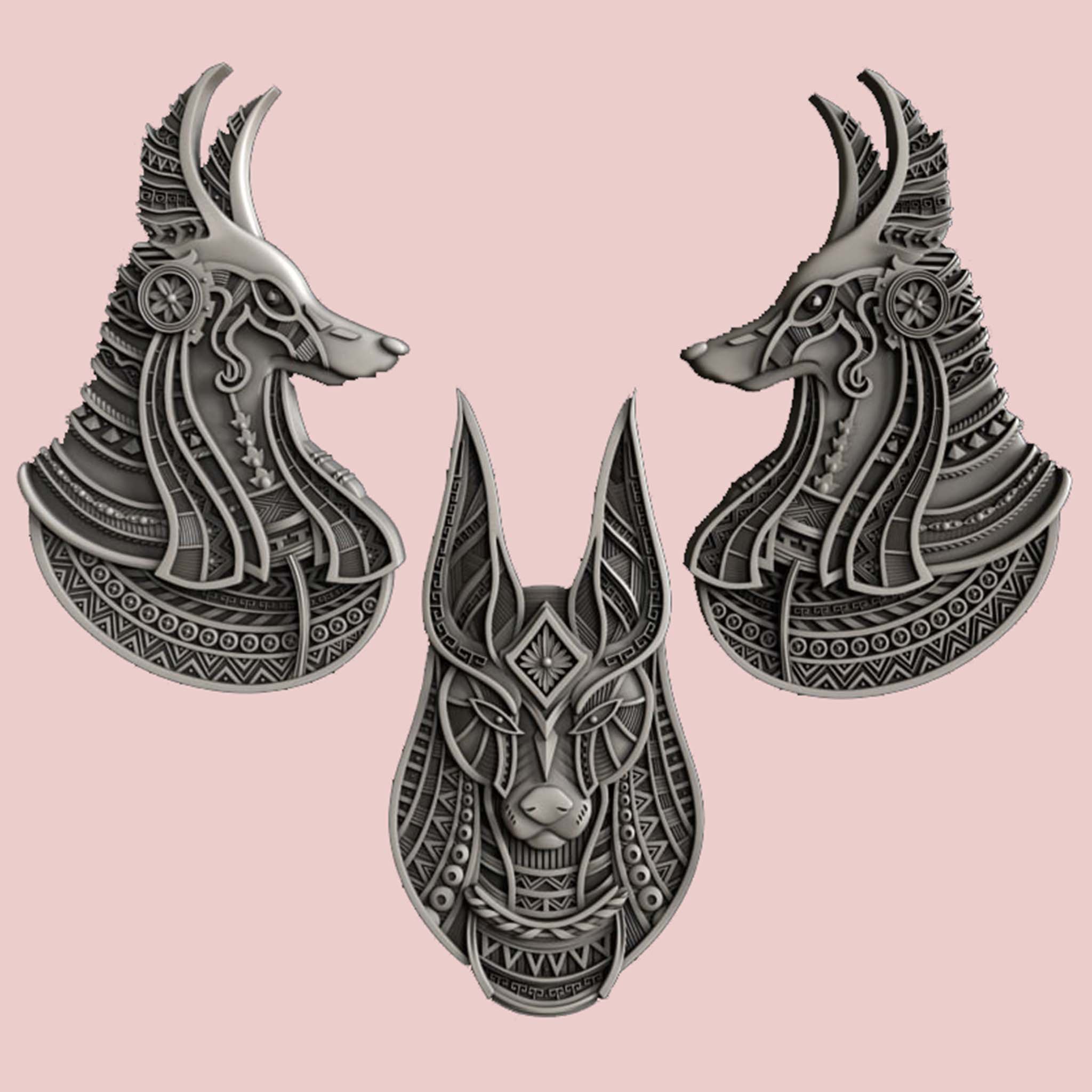 Grey silicone mold castings of 3 detailed Anubis heads.
